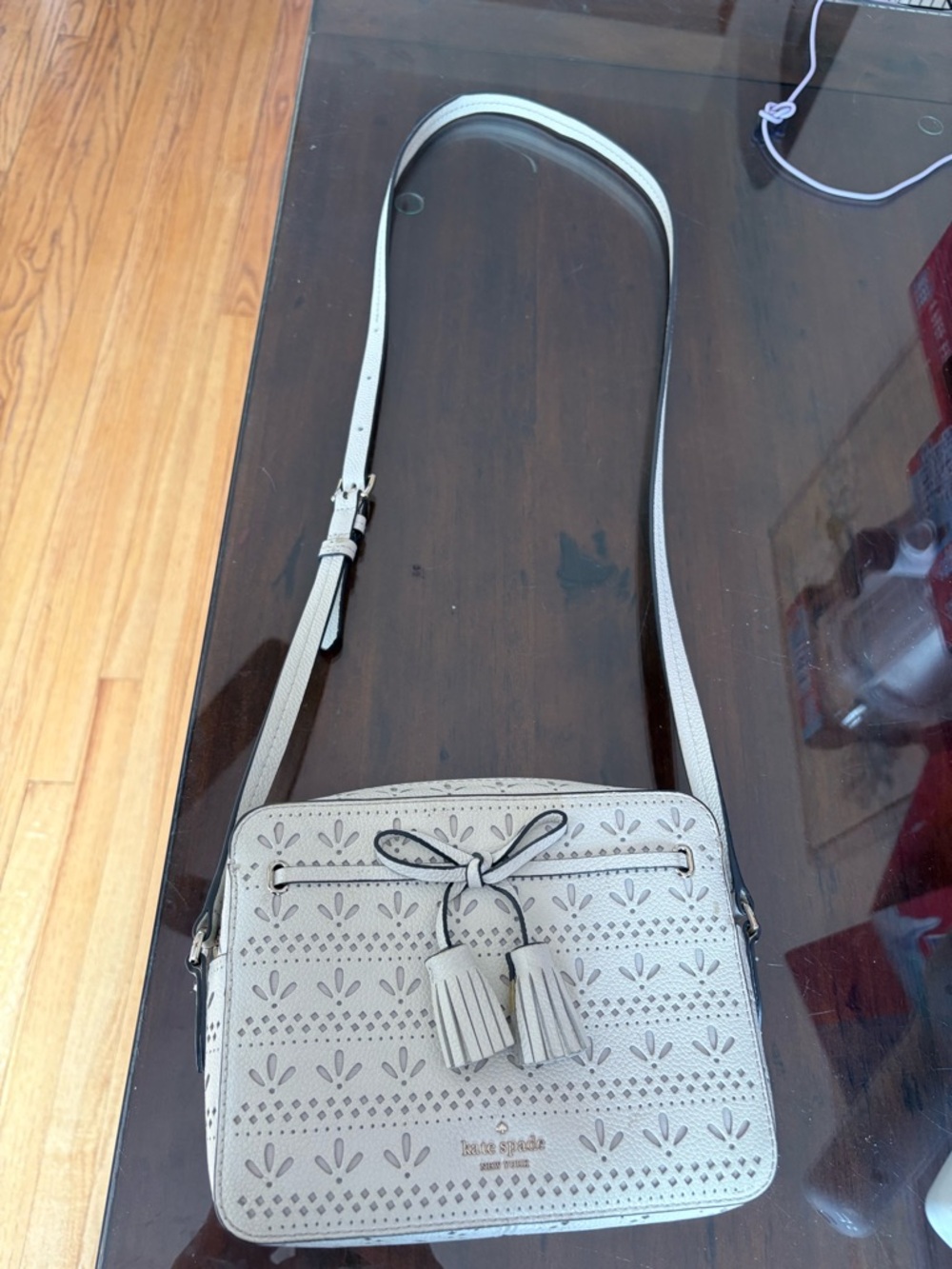 kate spade Cream Perforated Tassel Crossbody Bag